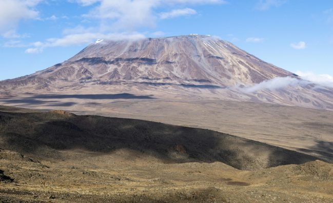 mountain with lush vegetation and blue sky
